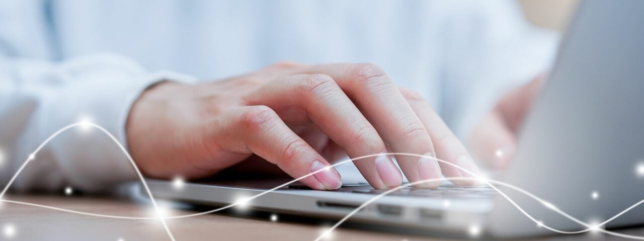 young man typing on keyboard computer to surfing the internet with virtual interface fiber optical telecommunication to exchange data information in the cyber network for business and future concept